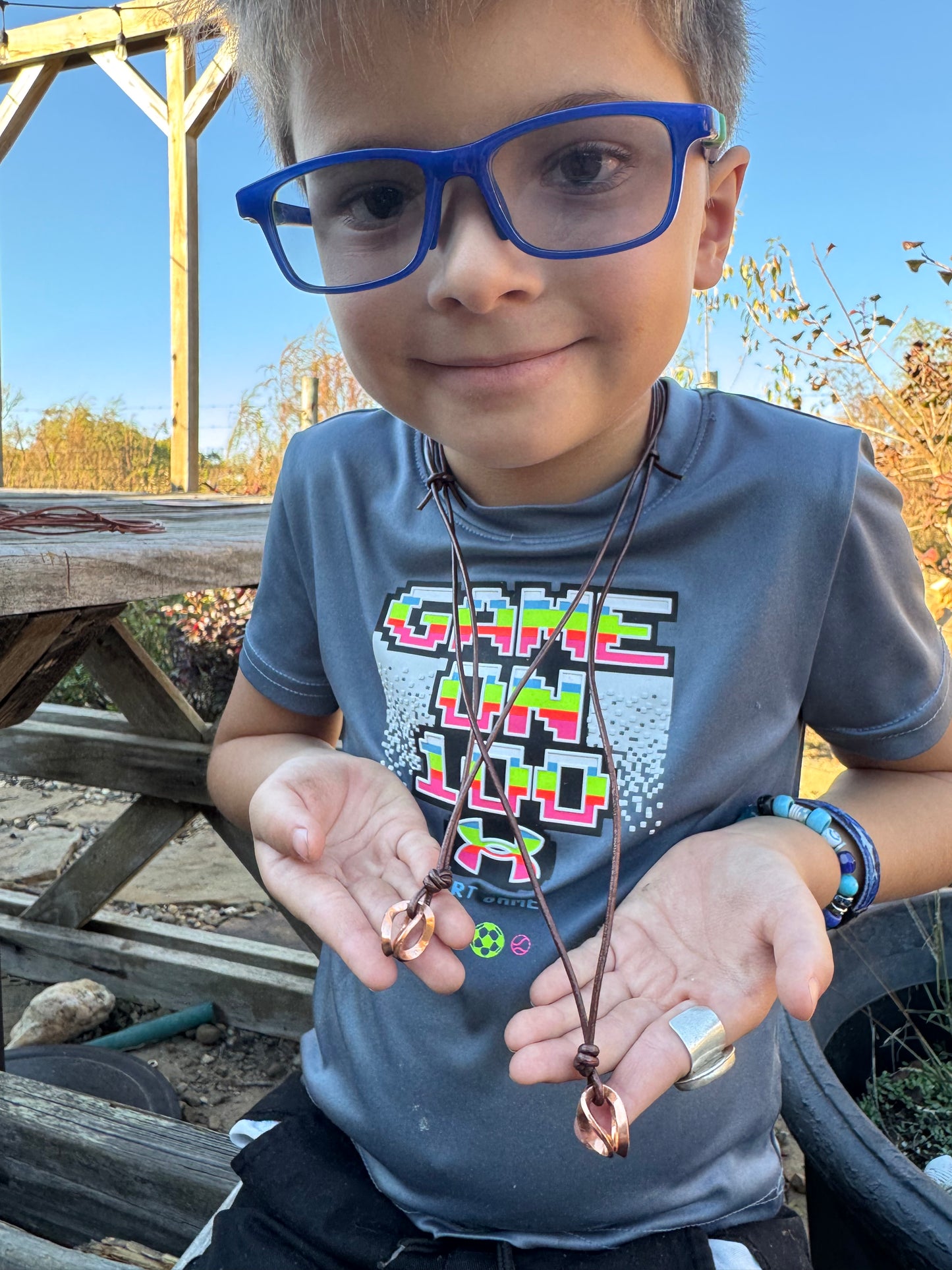 Copper and metallic Leather necklaces made by Logan
