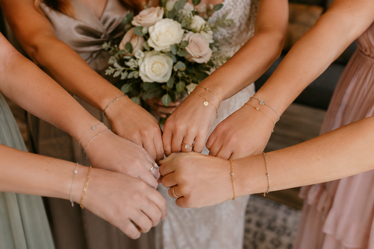 Bridesmaids wearing permanent jewelry during a Broken Bow wedding weekend