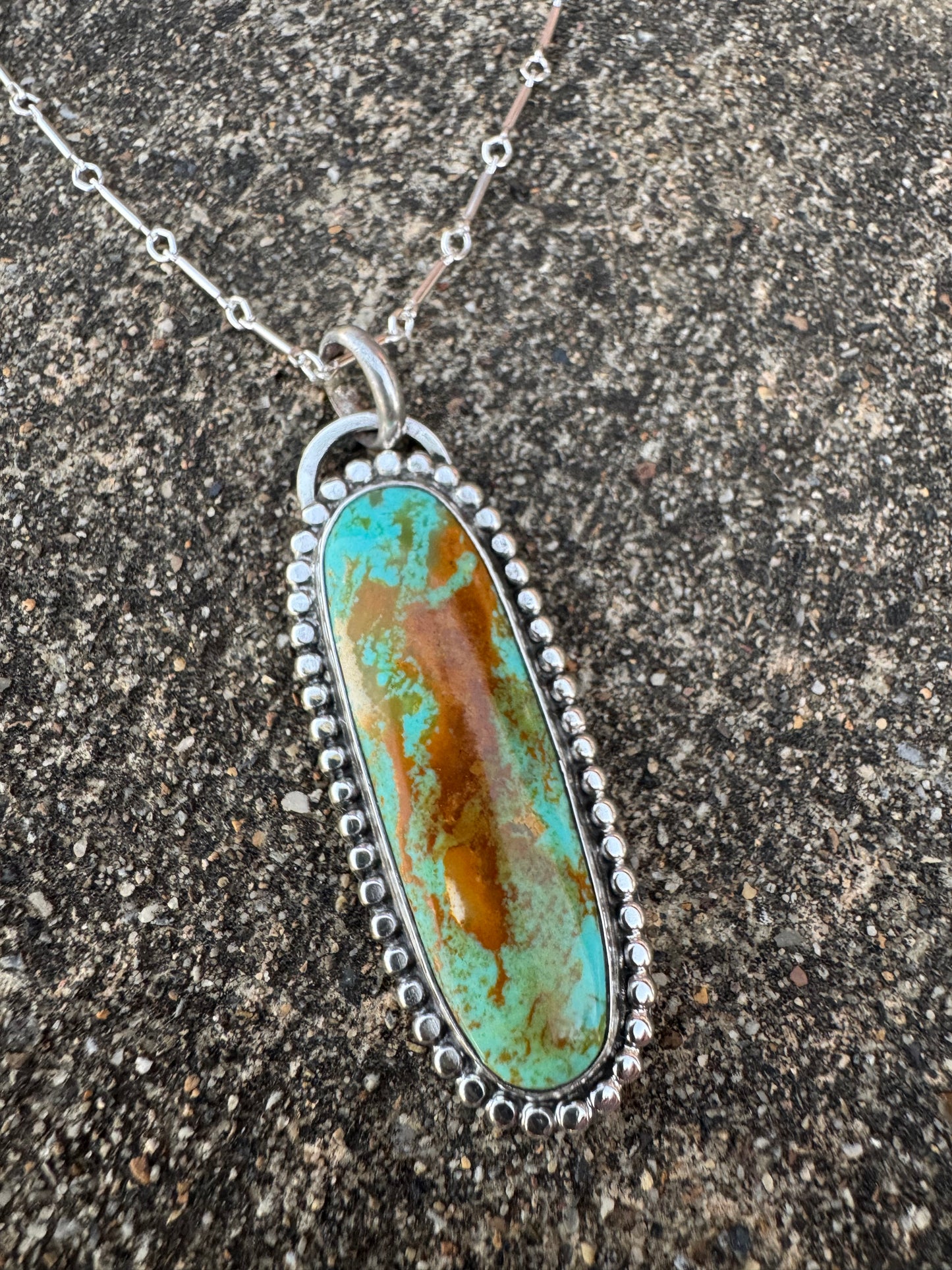 Long Tyrone turquoise beaded detail pendant