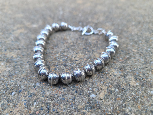 Solid sterling silver stamped Navajo pearl bracelet