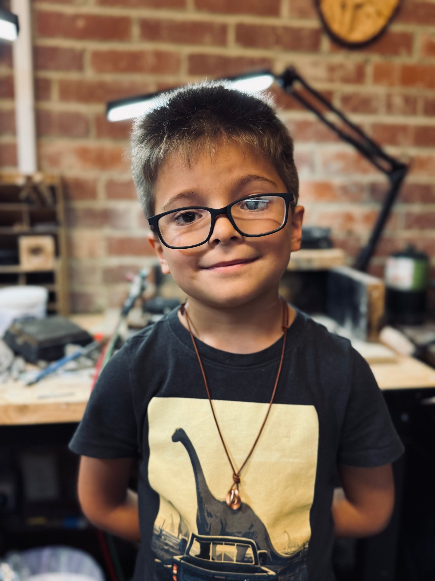 Copper and leather adjustable necklace made by Logan