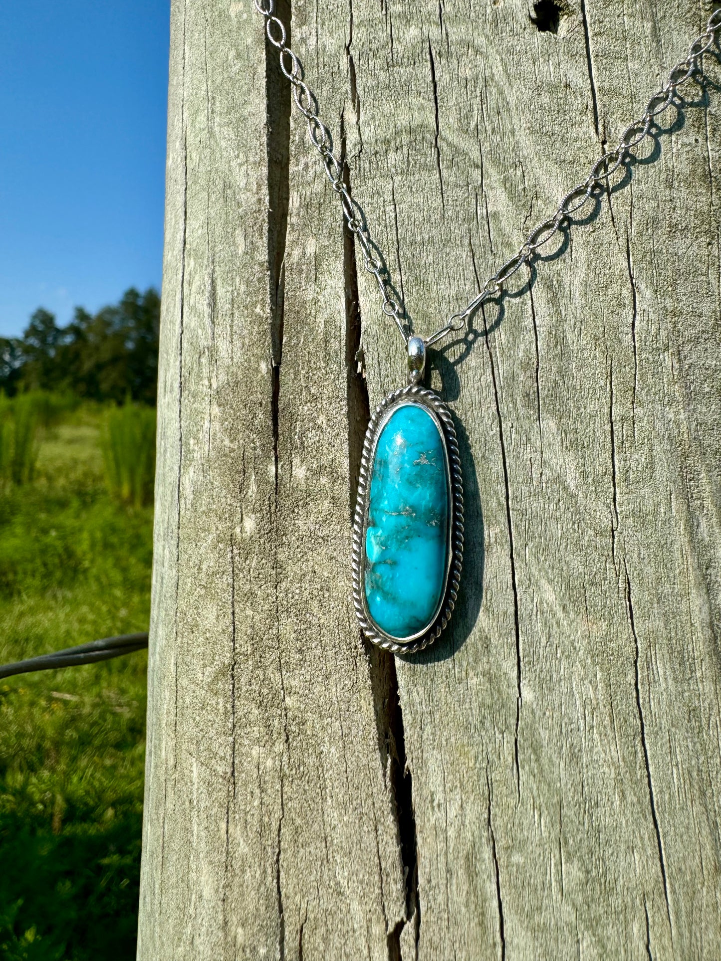 Bright blue Kingman turquoise pendant